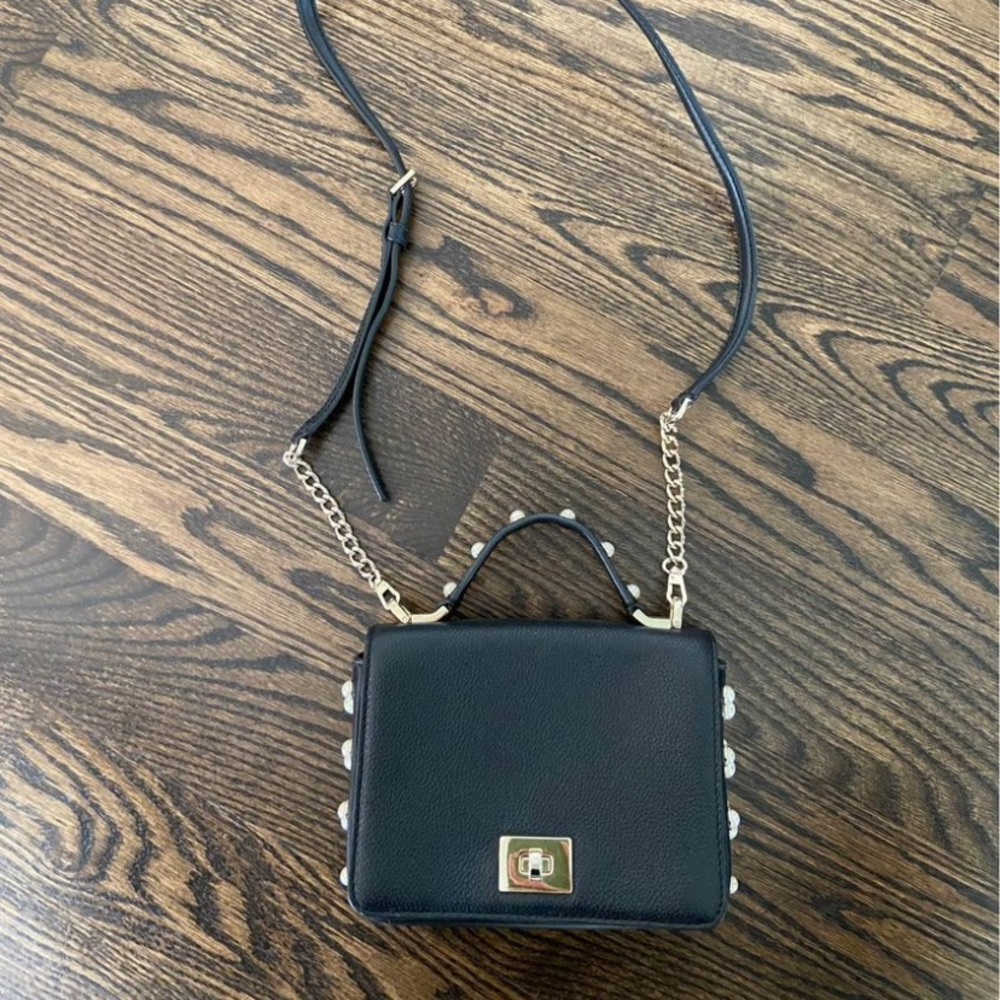 Kate Spade small black purse with pearls. In great condition!